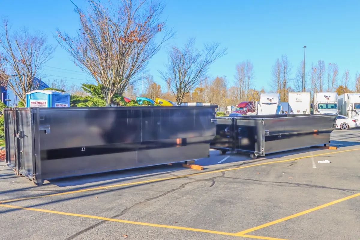 Professional dumpster rental service with roll-off container on residential driveway in Sunnyvale